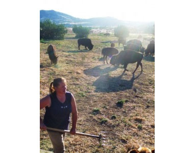 Inge with pitchfork compressed Inge Bobek feeds the bison every day